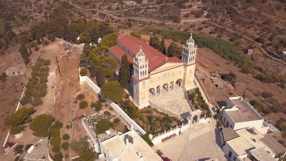 Panning Aerial Shot of a Beautiful Church on the Island Village of Lefkes Greece