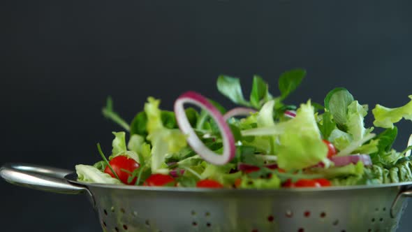 Fresh Salad Flying to Colander in Super Slow Motion