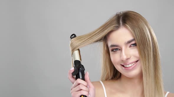 Cute Girl Making Herself a Hairstyle