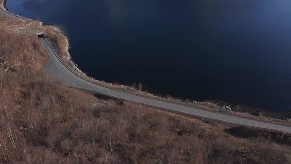 Crazy Norway roads with epic tunnel passing through landslide between mountainside and fjord - Aeria