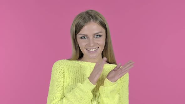 Cheerful Happy Girl Clapping and Smiling Pink Background