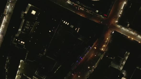 AERIAL: Slow Overhead Shot of City at Night with Lights and Traffic, Cologne, Germany 