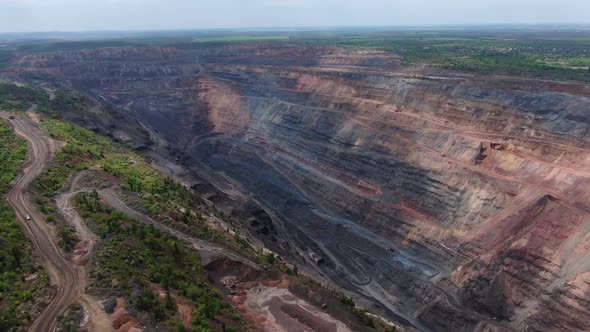 Aerial View on Massive Quarry Landscape of Huge Pit and Nature Film Grain