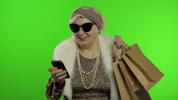 Elderly Caucasian Grandmother Woman Using Smartphone for Shopping. Chroma Key