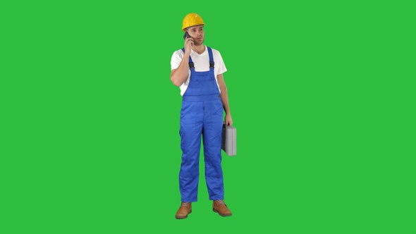 Construction Worker On Telephone on a Green Screen, Chroma Key.