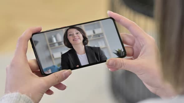 Old Woman Talking During Video Chatting in Smartphone Screen