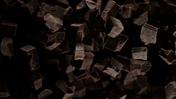 Super Slow Motion Shot of Raw Chocolate Chunks After Being Exploded Towards The Camera at 1000Fps