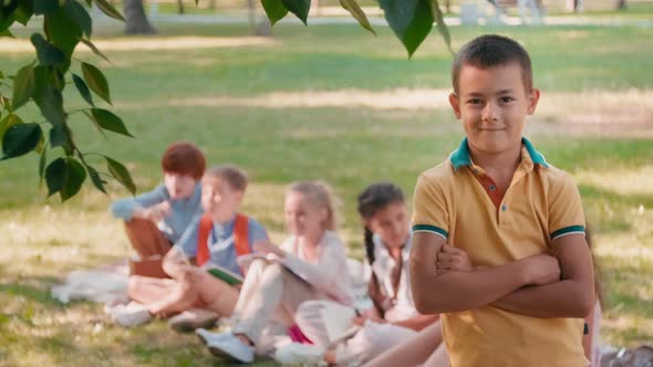 Schoolboy Posing in Park during Lesson