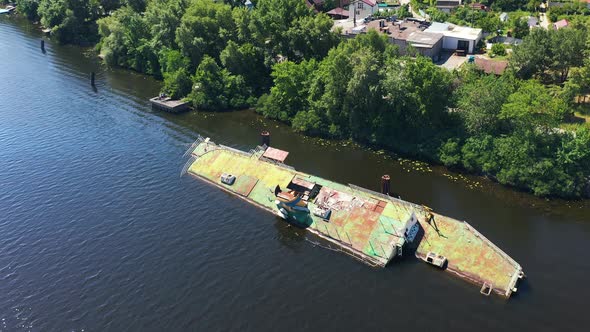 Aerial Shot of Old Rusty Abandoned Ship in the Middle of the Day