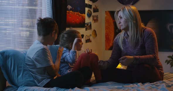 Mother Talking with Bickering Siblings