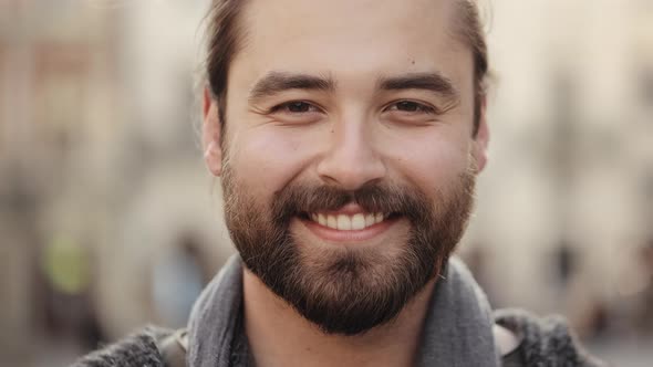 Portrait of a Bearded Happy Man Who is Looking at the Camera and Smiling