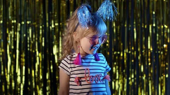 Portrait of Trendy Stylish Girl Showing Magic Tricks Gestures Fooling Around at Disco Night Club