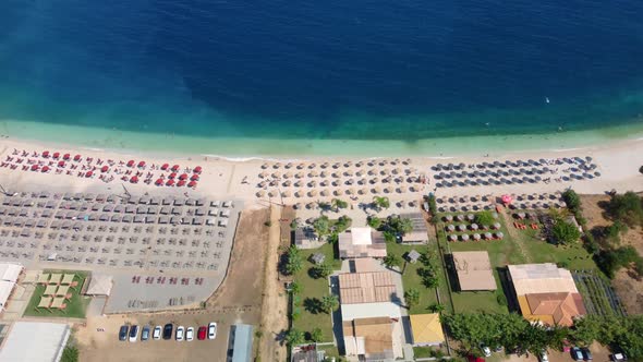 Fabulous beautiful magic landscape with umbrellas and  sun beds on the seafront on Antisamos Beach o