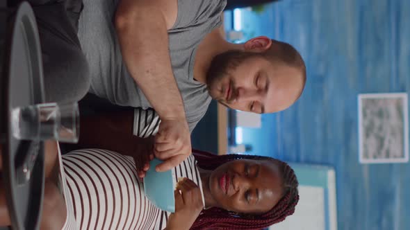 Vertical Video Interracial Couple with Pregnancy Watching Movie on TV