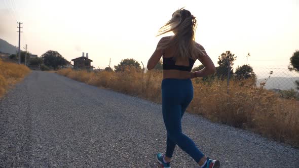 Follow to Young Girl Running at Country Road