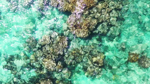 Wide angle drone abstract view of a paradise sunny white sand beach and blue sea background