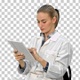 Female doctor working on digital tablet, Alpha Channel - VideoHive Item for Sale
