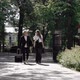 Young Couple Man and Woman Walking Street in Summer Rolling Suitcase on Wheels - VideoHive Item for Sale