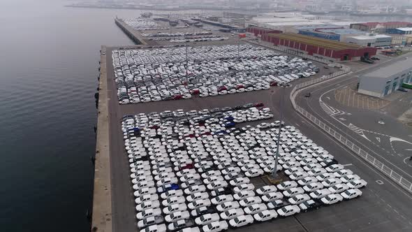 Motion Over Rows of Finished Cars at Open Warehouse Lot