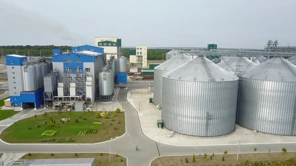Aerial view. Metal grain elevator in agricultural zone. Grain warehouse