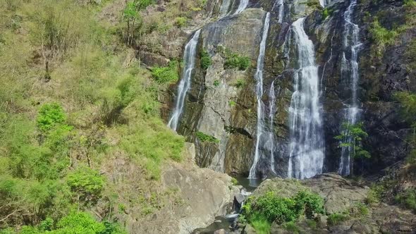 Quadrocopter Moves From Mountain River Up To Waterfall Top