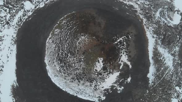 Birds Eye Aerial View of Inactive Volcano Crater in Highlands of Iceland. Snowy Landscape in Rural C