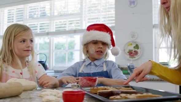 Family making Christmas cookies at home