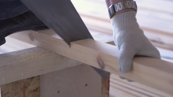 Beauty of Slow Motion in Construction and Repair - Construction Work - a Man Sawing Sawn Wooden