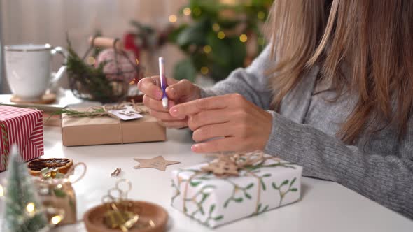 Woman s Hands Wrapping Christmas Gift Boxes Close Up