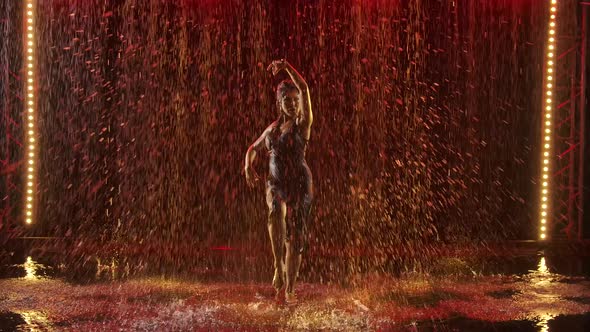 Happy Wet Woman Passionately Dancing Flamenco in the Rain. Graceful Hand Movements in Slow Motion