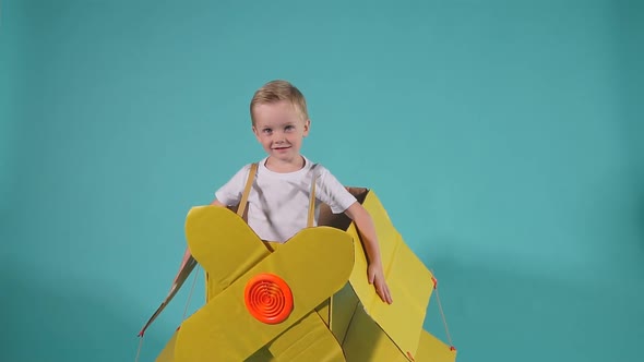 Child Boy Dreaming To Be a Pilot, Imagine Flying on Airplane.