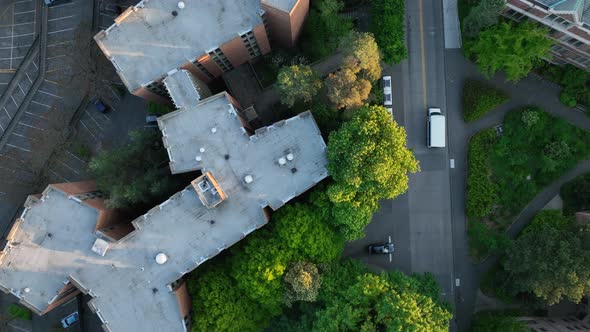 Overhead aerial of a white delivery truck driving through campus at the University of Washington.