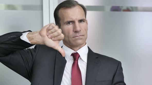 Thumbs Down By Businessman