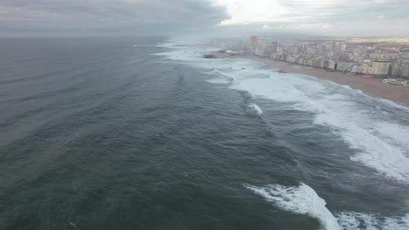 4k video of waves of the atlantic ocean crashing on the sandy shore in the evening