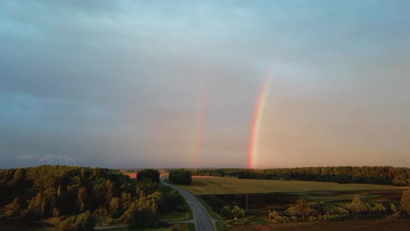 Dark Thunderstorm Clouds and Double Rainbow Over Forest and Wheat Field, Areal Dron Shoot.