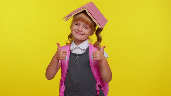 Smiling Schoolgirl Reading Book Making Playful Silly Facial Expressions Grimacing Fooling Around