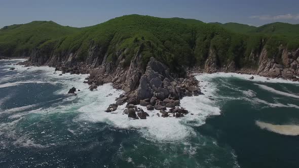 View From a Droneon a Stone Cape Washed By Strong Waves