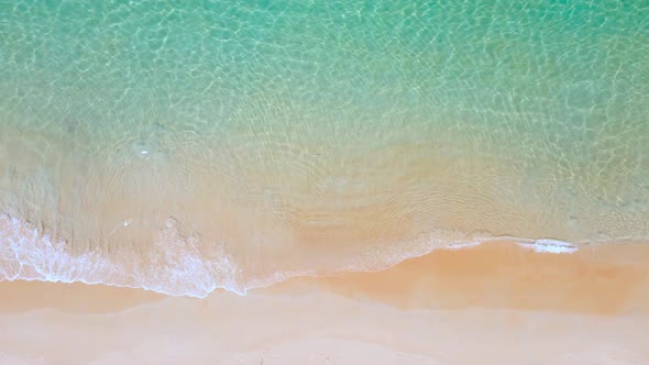 Aerial view top view beach sea on good weather day crystal water wave in summer Phuket Thailand