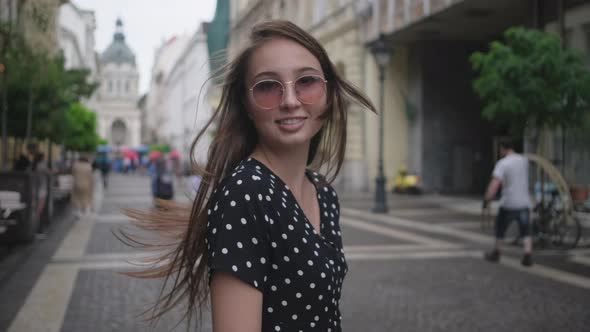 Pretty Cheerful Girl Walking in the Street of Budapest Hungary