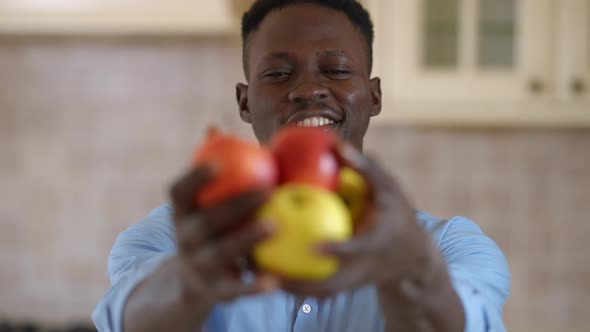 Front View Smiling Young Man Bragging Organic Healthful Apples Standing Indoors