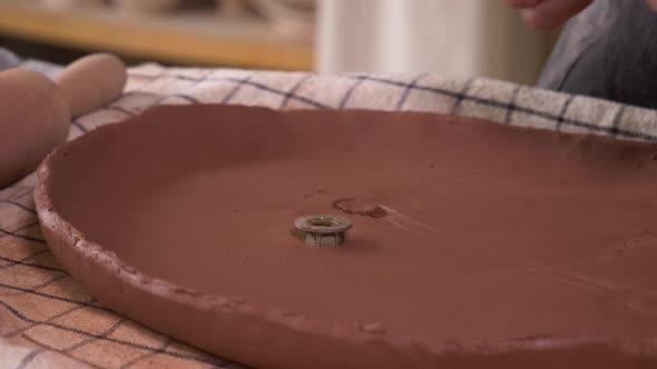 Potter Sculpts Dishes From Clay