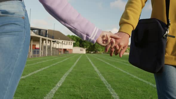 Teenager couple hanging out in their school grounds