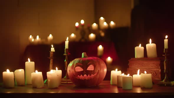 Jackolantern and Burning Candles Closeup