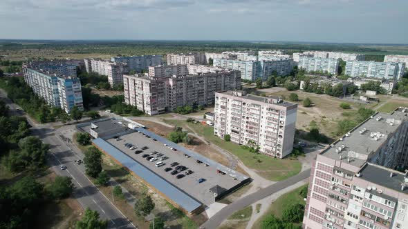 Aerial View MultiStorey Buildings Near Green Forest in Residential Area at City