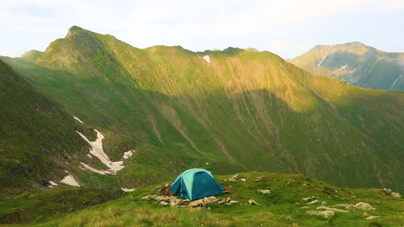 Time Lapse of Tent on the Background of the Mountains