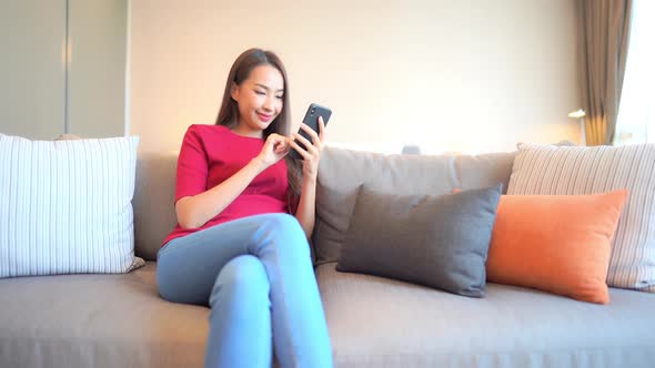 Young asian woman use smart phone