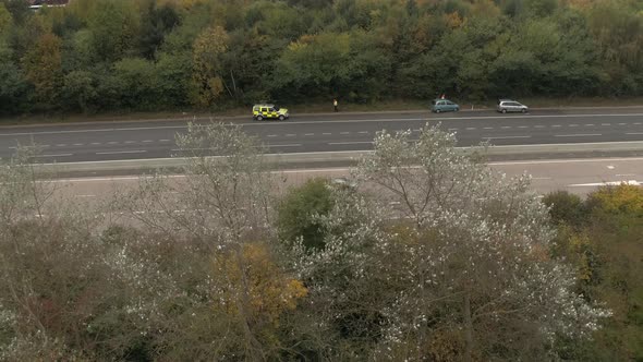 Reveal Shot of Police Attending Accident on M6 Motorway