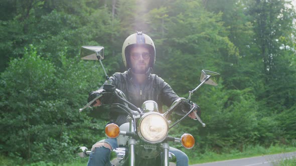 Relaxed man riding a motorcycle