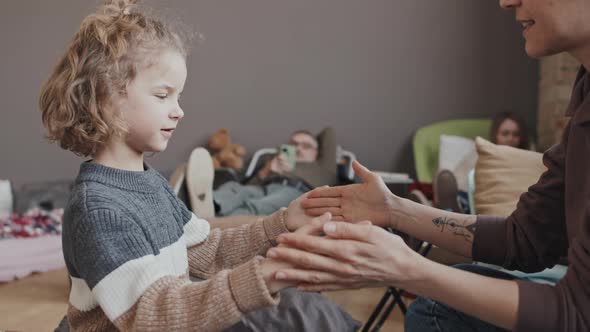 Boy Playing with Mom in Shelter