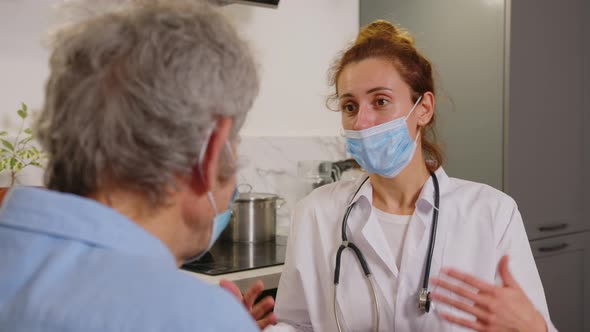 Therapist Wear White Coat Face Mask Due Corona Virus Pandemic Outbreak Talk to Elderly Patient